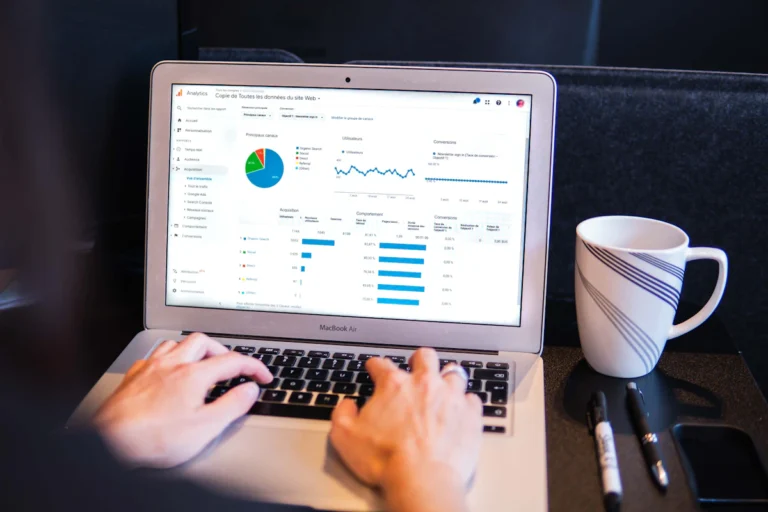 SEO professional reviewing analytics and a link campaign strategy on a laptop