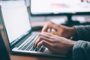 Laptop and digital workspace representing business documentation and customer questions