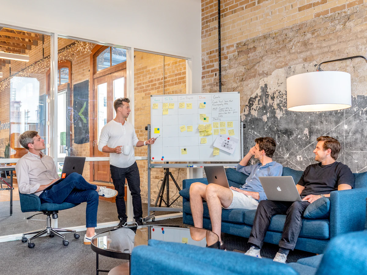 Business team planning implementation tasks and onboarding milestones in a meeting