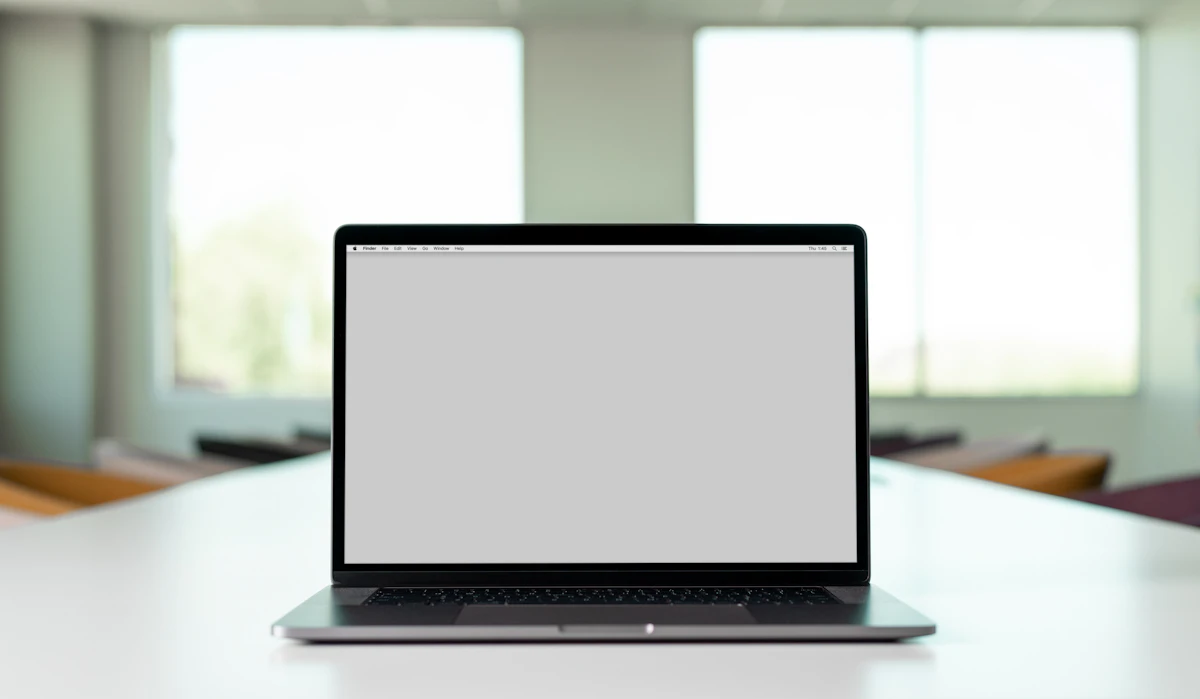 Laptop and digital workspace representing a searchable library of business guides and resources