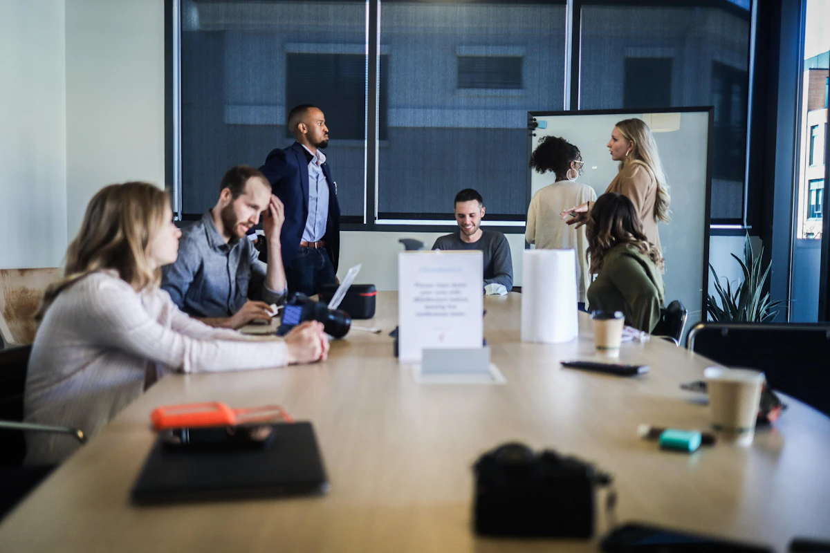 Business professionals reviewing campaign documents together, representing SEO agency expertise