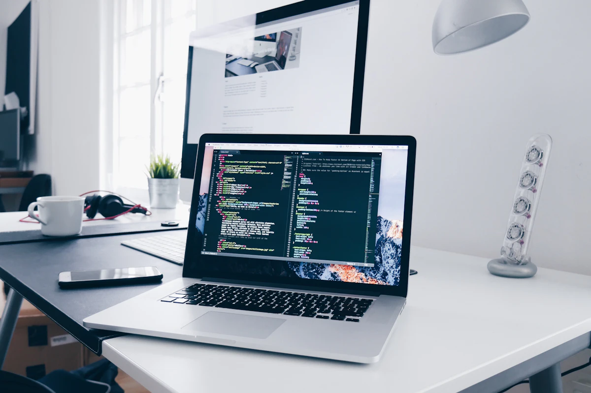 Developer workstation and computer screen representing API documentation and software coding