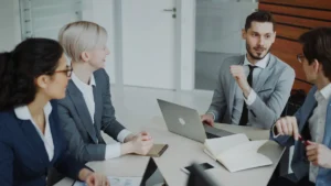 Business team reviewing information together to evaluate software options